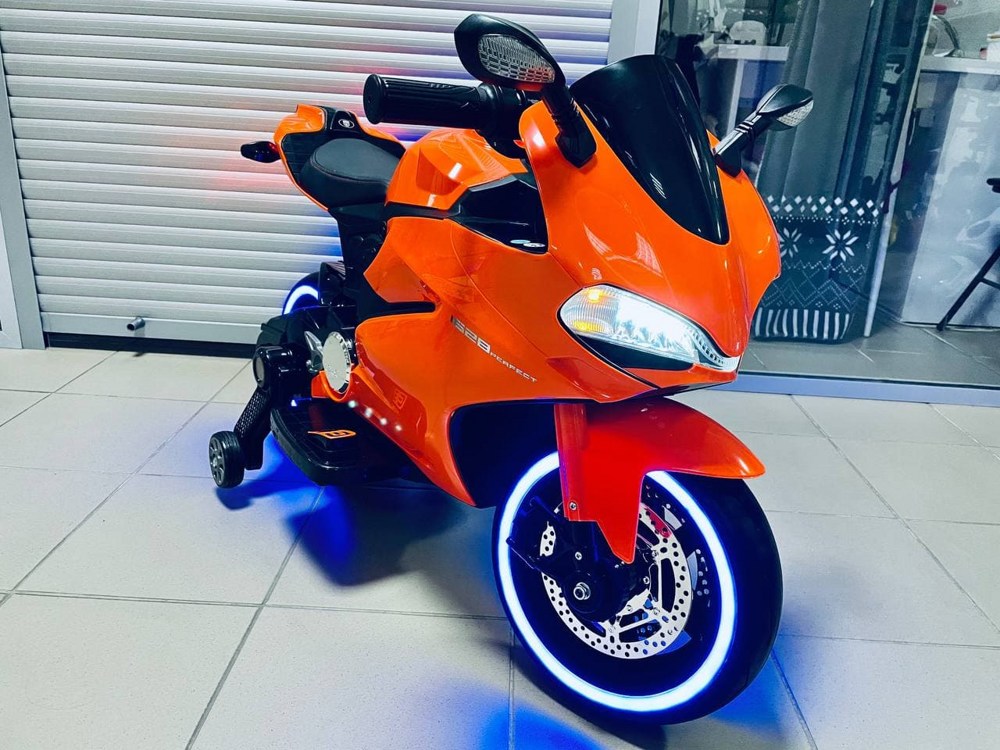 Детский электромобиль, мотоцикл RiverToys A001AA (оранжевый) Ducati - фото